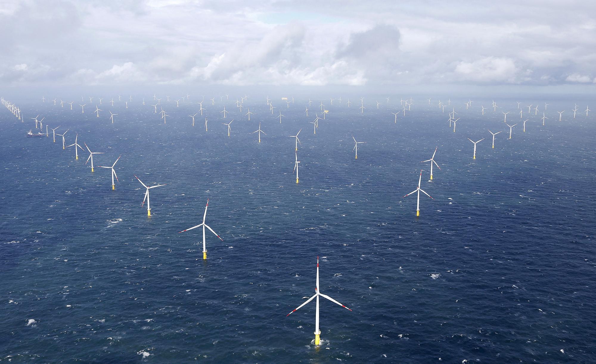 FILE PHOTO: Power-generating windmill turbines are pictured at the 'Amrumbank West' offshore windpark in the northern sea near the island of Amrum, Germany September 4, 2015. REUTERS/Morris Mac Matzen/File Photo