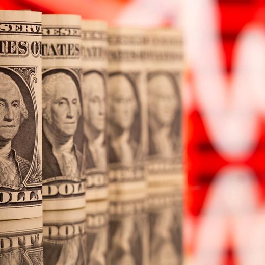 FILE PHOTO: U.S. One dollar banknotes are seen in front of displayed stock graph in this illustration taken, February 8, 2021. REUTERS/Dado Ruvic/Illustration/File Photo