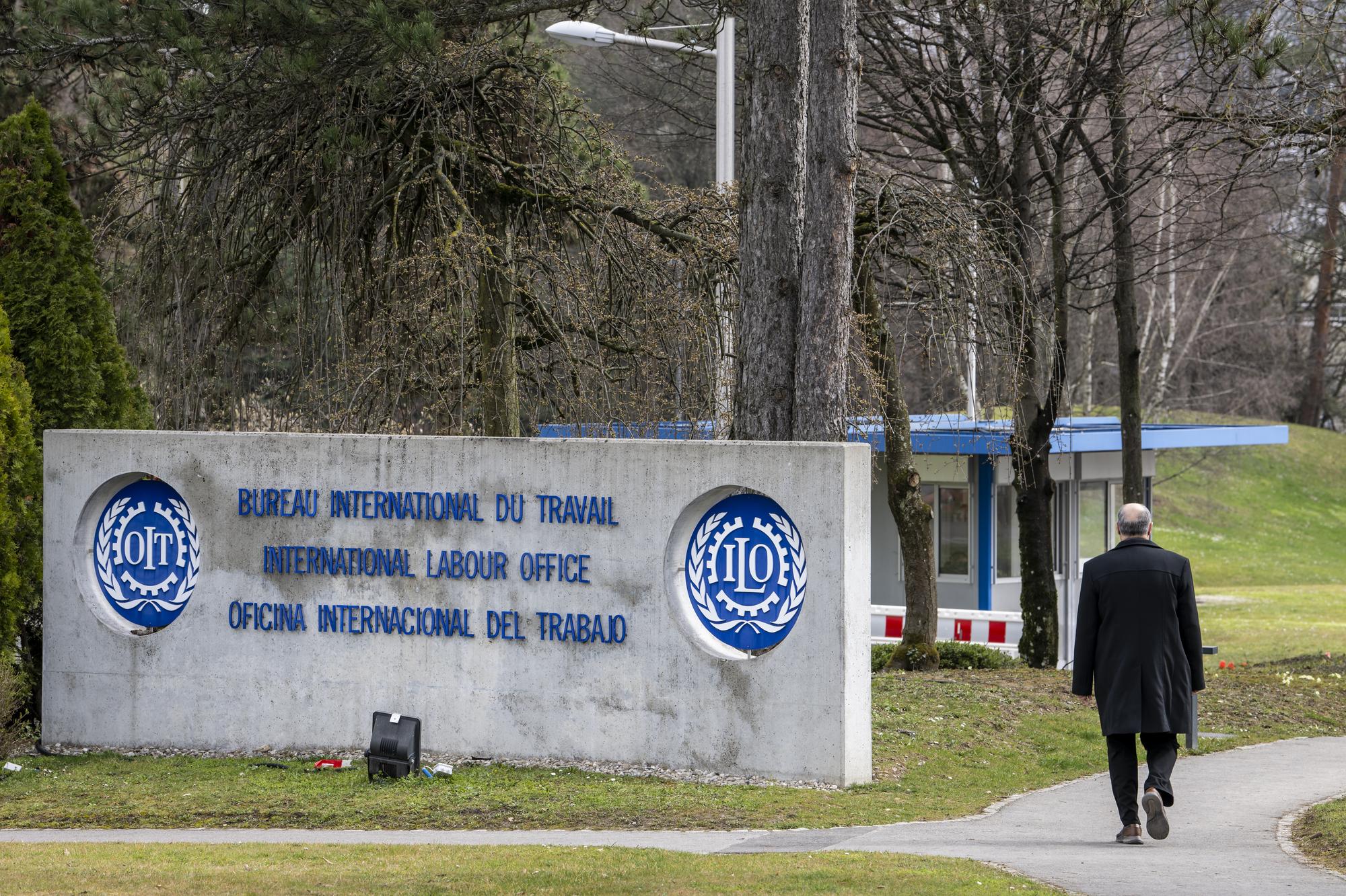 The logo of the International Labor Organization (OIT ILO BIT) is pictured at the Intermational Labour Organisation headquarters in Geneva, Switzerland, Wednesday March 16, 2022. (KEYSTONE/Martial Trezzini).