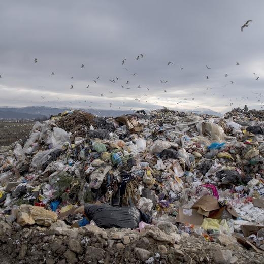 This picture taken on January 14, 2021, shows an illegal dumpsite near the city of Struga. The Western Balkans are home to some of Europe's wildest rivers and most pristine tracts of nature. But failing waste management systems across the region are threatening the environment and public health. Heavy rains in January highlighted the problem after floods swept garbage from roadsides and other illegal dumps into rivers. (Photo by Robert ATANASOVSKI / AFP)