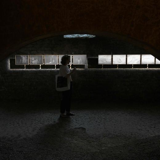 A visitor looks at the exhibition "La main de l'enfant" by French artist Juliette Agnel on the opening day of "Les Rencontres d'Arles" photography festival in Arles, southern France, on July 3, 2023. (Photo by Nicolas TUCAT / AFP) / RESTRICTED TO EDITORIAL USE - MANDATORY MENTION OF THE ARTIST UPON PUBLICATION - TO ILLUSTRATE THE EVENT AS SPECIFIED IN THE CAPTION