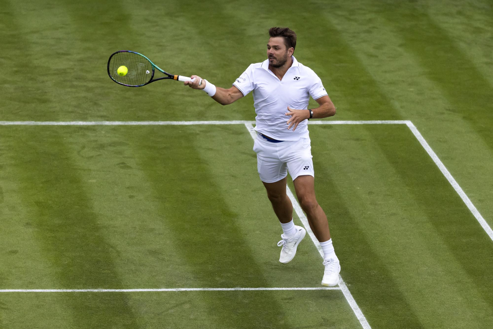Stan Wawrinka of Switzerland in action during his first round match against Emil Ruusuvuori of Finland at the All England Lawn Tennis Championships in Wimbledon, London, Monday, July 3, 2023. (KEYSTONE/Peter Klaunzer)