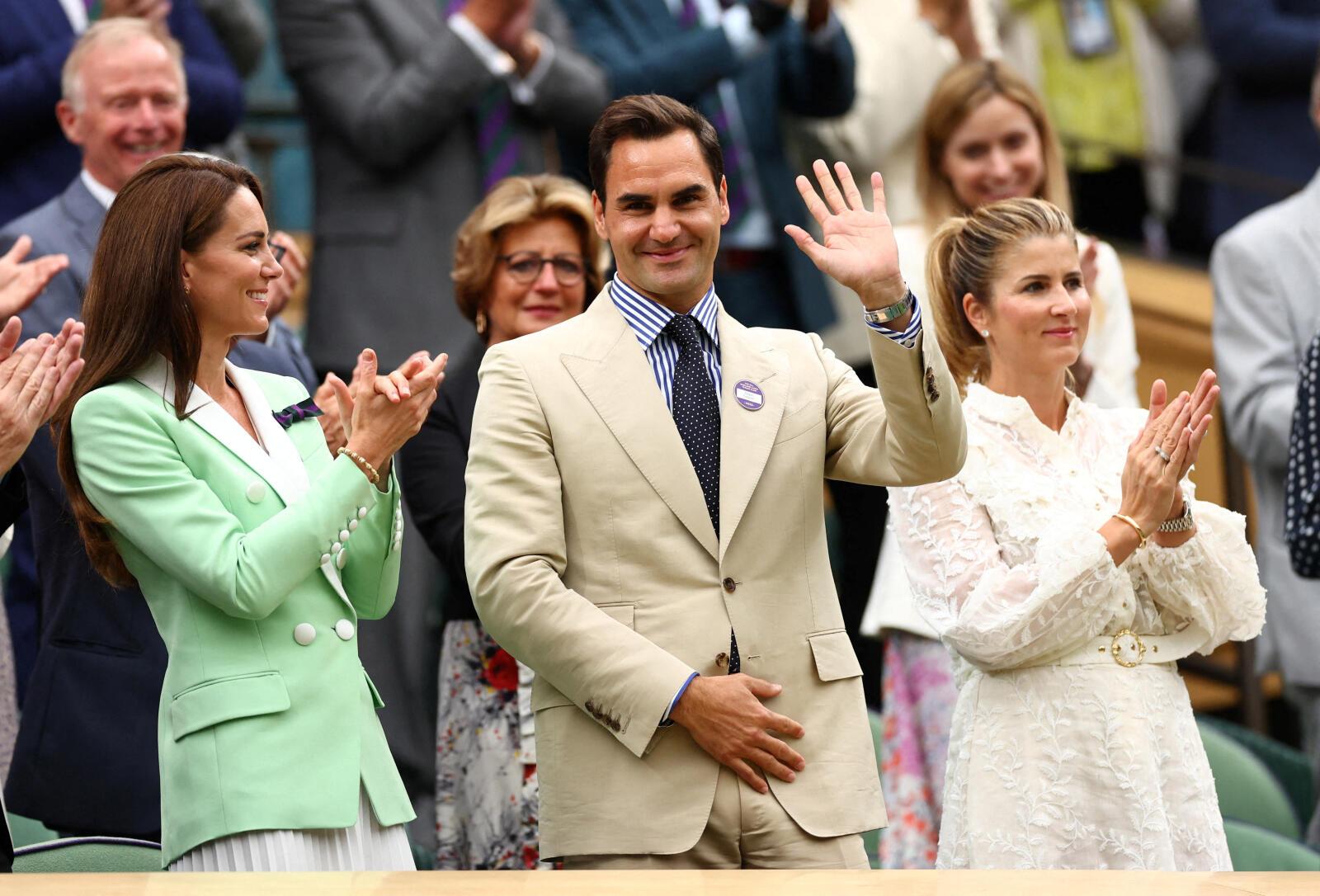 Tennis - Wimbledon - All England Lawn Tennis and Croquet Club, London, Britain - July 4, 2023 Eight-time Wimbledon champion Roger Federer stands alongside Catherine, Princess of Wales and wife Mirka Federer during a presentation on centre court to honour his achievements REUTERS/Toby Melville TPX IMAGES OF THE DAY