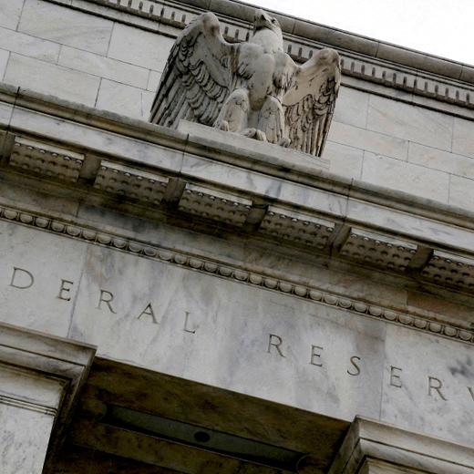 FILE PHOTO: An eagle tops the U.S. Federal Reserve building's facade in Washington, July 31, 2013. REUTERS/Jonathan Ernst/File Photo