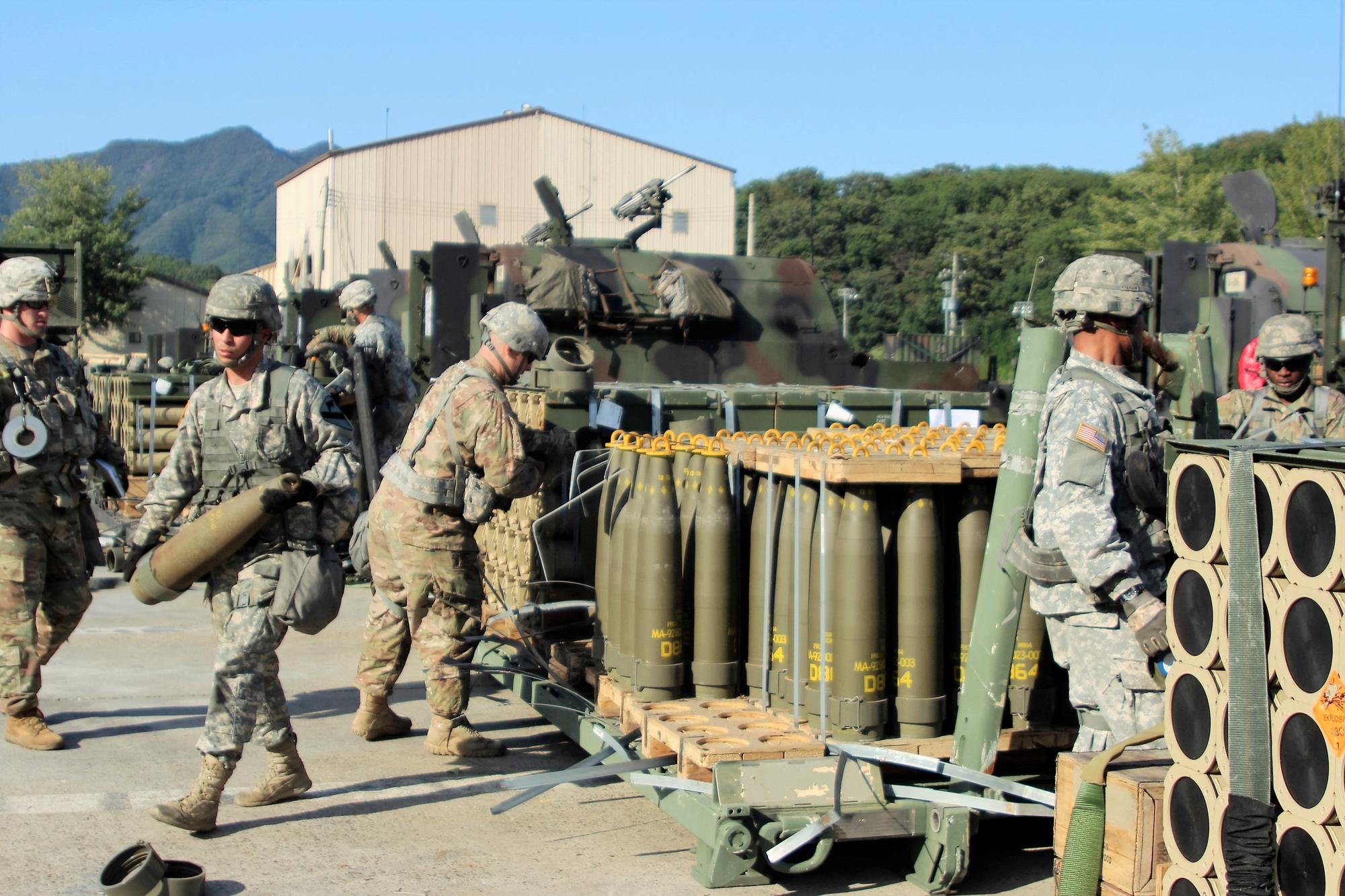 U.S. Army soldiers draw 155mm Base Burn Dual Purpose Improved Conventional Munition (DPICM) rounds to carry into their vehicles during a load exercise at Camp Hovey, South Korea September 20, 2016. U.S. Army/2nd Lt. Gabriel Jenko/Handout via REUTERS THIS IMAGE HAS BEEN SUPPLIED BY A THIRD PARTY.