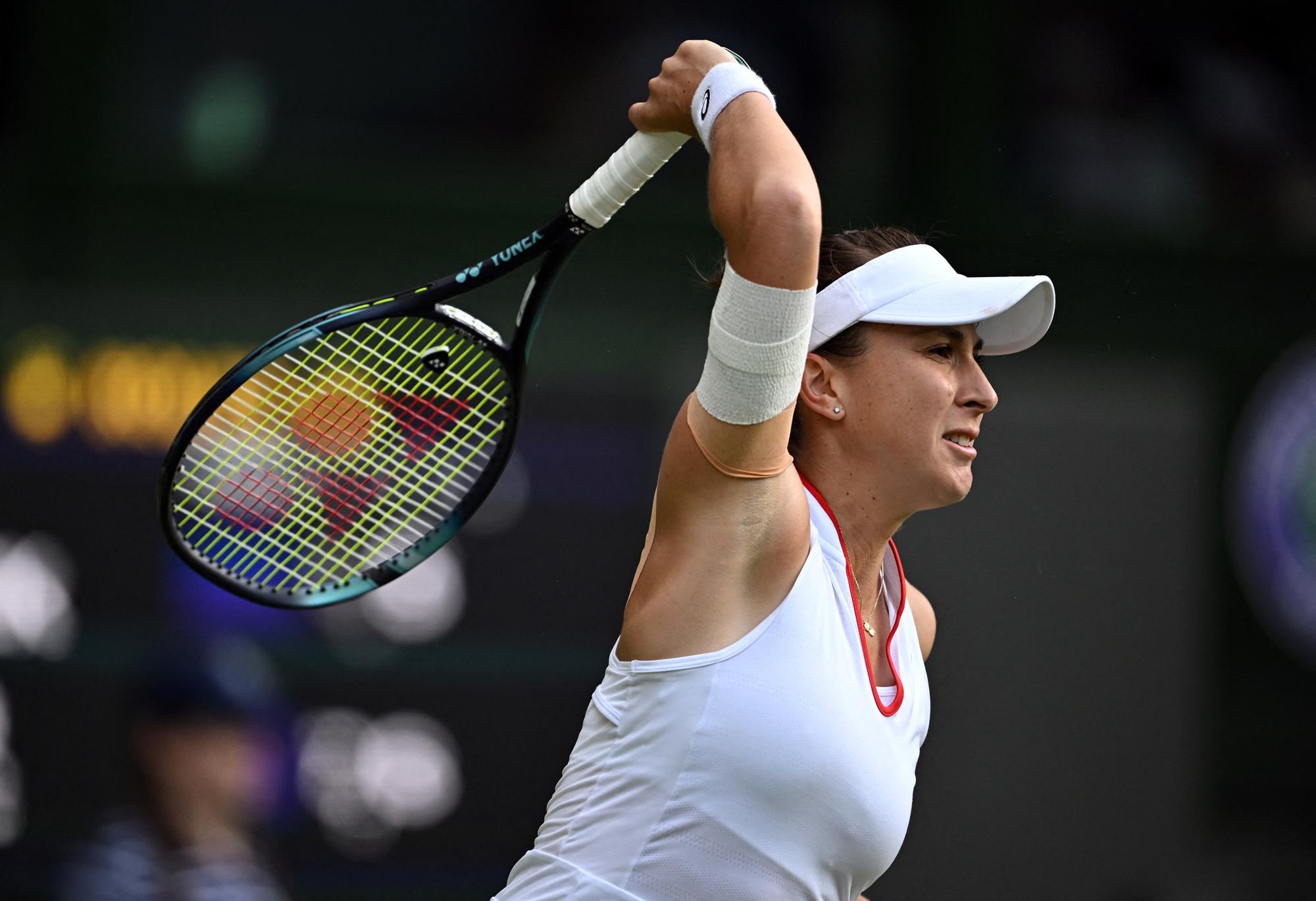 Tennis - Wimbledon - All England Lawn Tennis and Croquet Club, London, Britain - July 9, 2023  Switzerland's Belinda Bencic in action during her fourth round match against Poland's Iga Swiatek REUTERS/Dylan Martinez