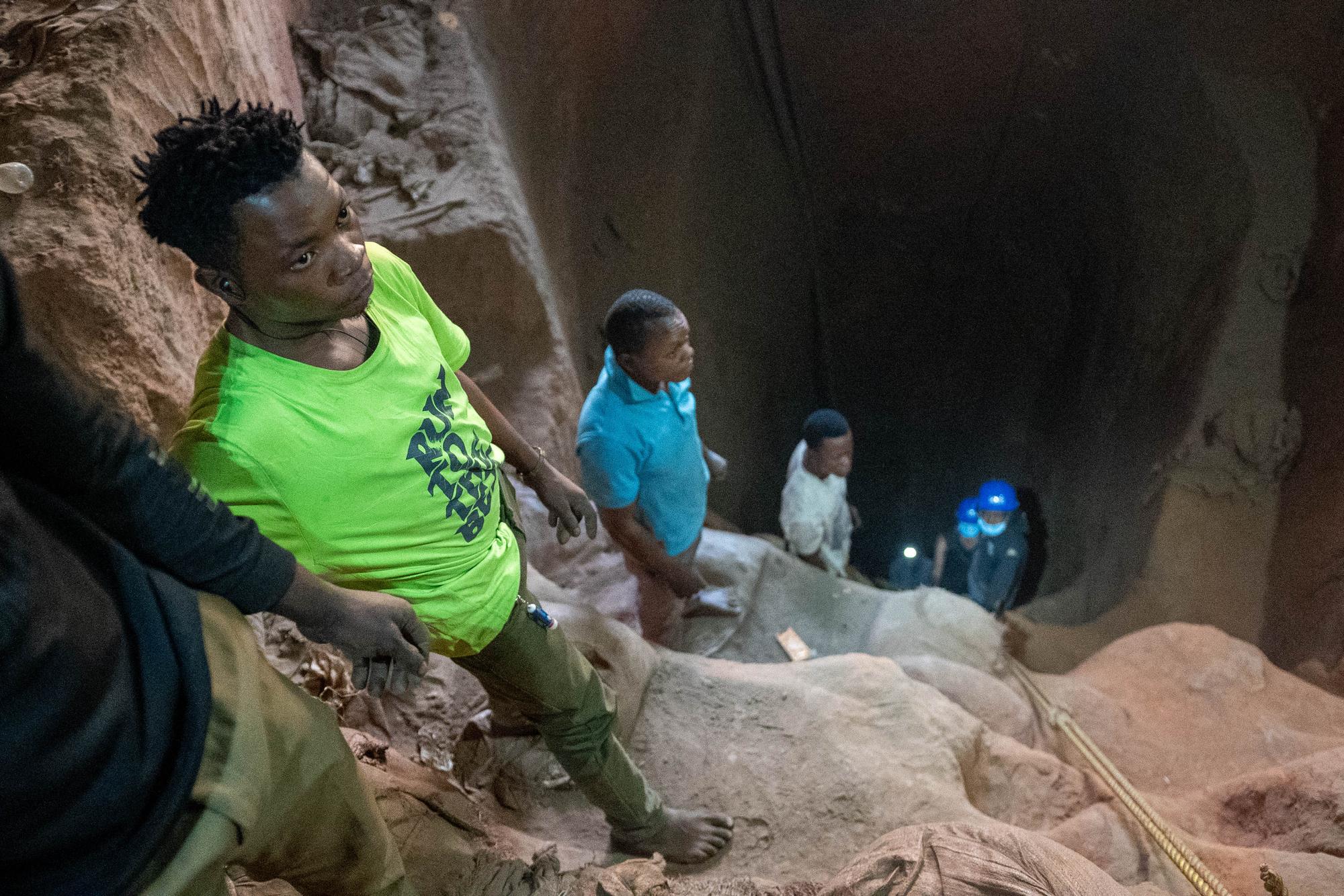 Artisanal miners stand in a shaft in Kamilombe, near the city of Kolwezi, in southeastern Democratic Republic of Congo, on June 20, 2023. The Democratic Republic of Congo produces over 70 percent of the global supply of cobalt. The metal is a critical component of batteries and seen as key to the renewable energy transition. Most of the central African country's cobalt is produced by industrial mines, but the it also has hundreds of thousands of informal diggers who toil in hazardous conditions. (Photo by Emmet LIVINGSTONE / AFP)