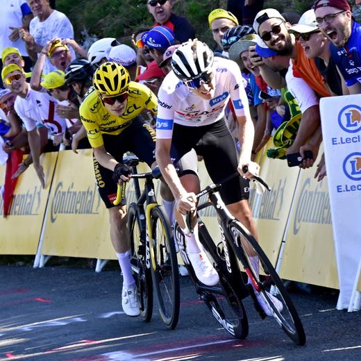 epa10746438 Slovenian rider Tadej Pogacar (R) of team UAE Team Emirates and Danish rider Jonas Vingegaard of team Jumbo-Visma in action during the 13th stage of the Tour de France 2023, a 138kms race from Chatillon-Sur-Charlaronne to Grand Colombier, France, 14 July 2023. EPA/PAPON BERNARD