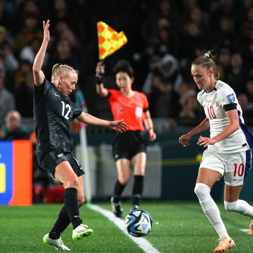 New Zealand's midfielder #12 Betsy Hassett (L) fights for the ball with Norway's forward #10 Caroline Hansen during the Australia and New Zealand 2023 Women's World Cup Group A football match between New Zealand and Norway at Eden Park in Auckland on July 20, 2023. (Photo by Marty MELVILLE / AFP)