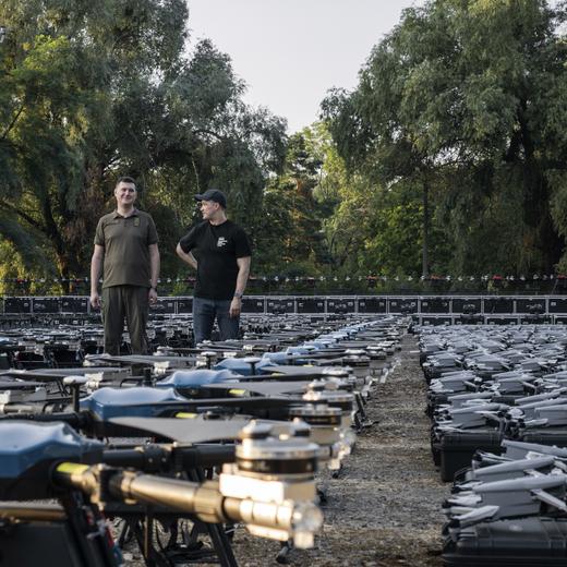 Mykhailo Fedorov, Ukrainian minister of digital transformation, right, and Yuriy Shchygol, head of State Special Communications Service, pose for a photo next to 1700 drones that are being sent to the frontline to be used against Russian forces, in Kyiv, Ukraine, Tuesday, July 25, 2023. (AP Photo/Libkos)