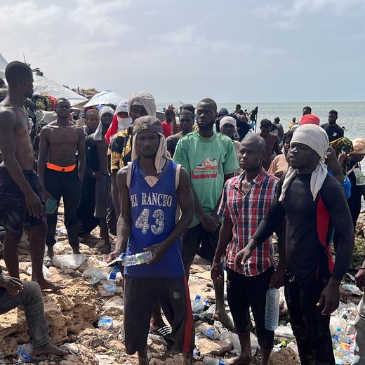 epa10770011 Sub-Saharan African migrants who were expelled from the city of Sfax in Tunisia gather in an area near the Libyan-Tunisia border, in Ras Jedir, 173 km west of Tripoli, Libya, 26 July 2023. Libyan border guards found some 150 people, women, children and families stranded in scorching summer temperatures and without water. According to the Red Crescent, Tunisian security forces have moved hundreds of migrants into the arid zone since June 2023. EPA/STR