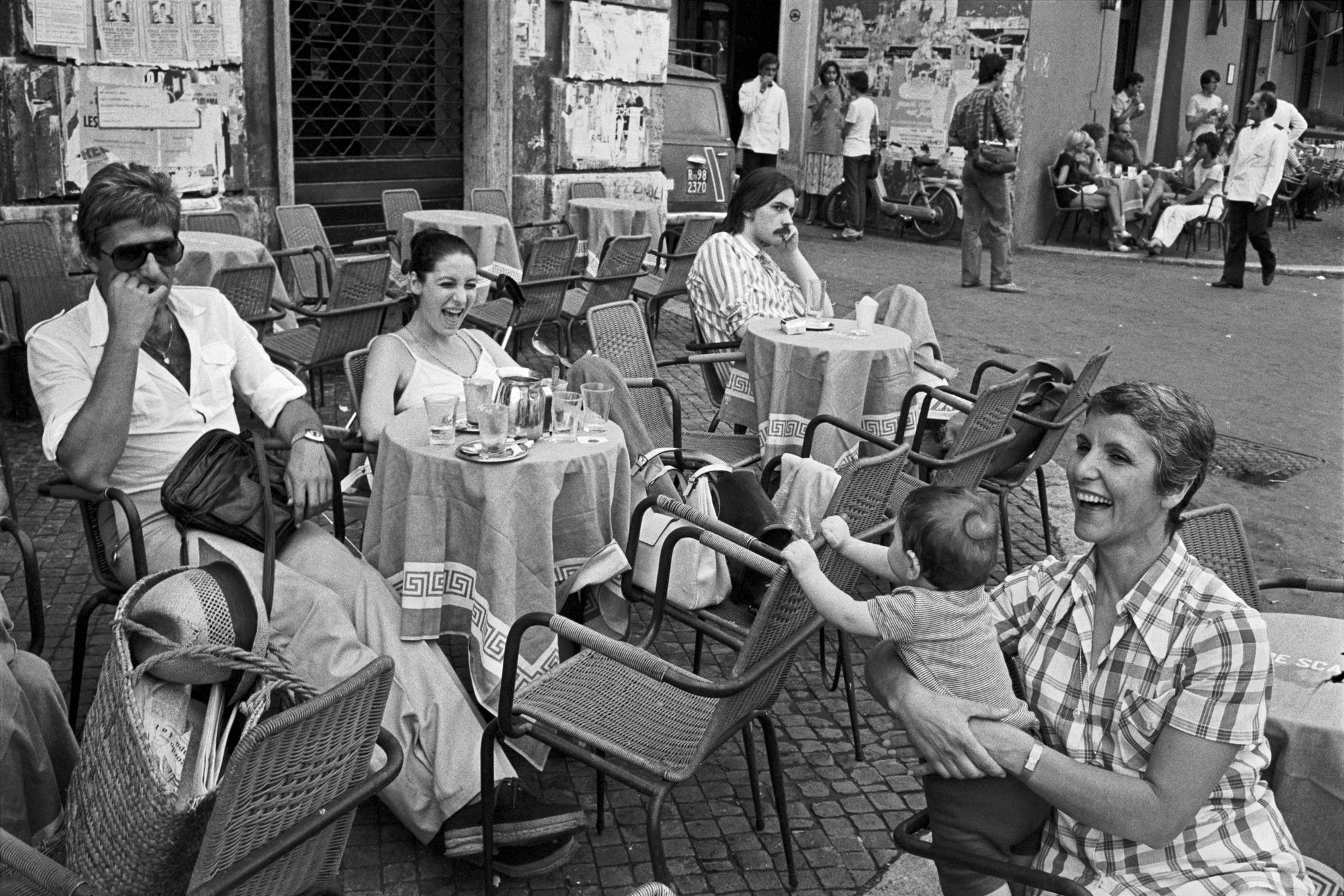 Italy. Rome. Outdoor café, Piazza Navona. Women and a baby. 1978
