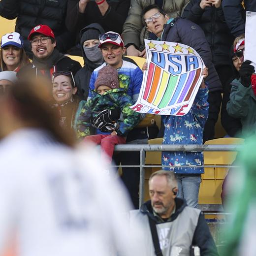 A United States fan holds a rainbow sign during the Women's World Cup Group E soccer match between the United States and the Netherlands in Wellington, New Zealand, Thursday, July 27, 2023. According to a count being kept by Outsports, a website that covers the LGBTQ sports community, there are at least 95 out members of the LGBTQ community competing in this year's tournament. (AP Photo/Alysa Rubin)