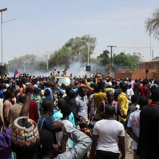 FILE PHOTO: Nigerien security forces launch tear gas to disperse pro-junta demonstrators gathered outside the French embassy, in Niamey, the capital city of Niger July 30, 2023. REUTERS/Souleymane Ag Anara NO RESALES. NO ARCHIVES/File Photo