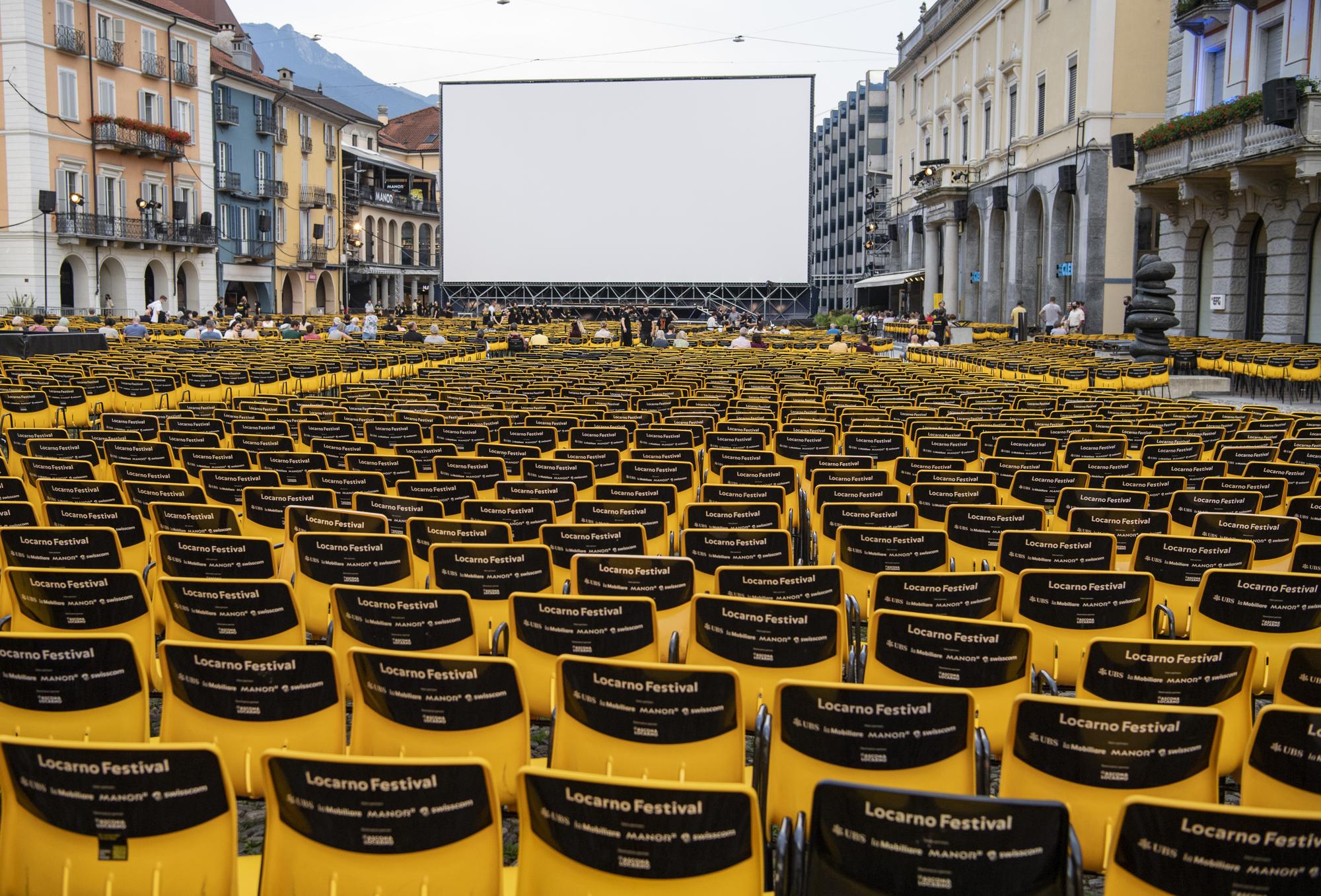 Only few visitors enjoy the film showing on the Piazza Grande during the 74th Locarno International Film Festival in Locarno, Switzerland, Monday, August 9, 2021. The Festival del Film Locarno runs from 4 to 14 August 2021. (KEYSTONE/Urs Flueeler)