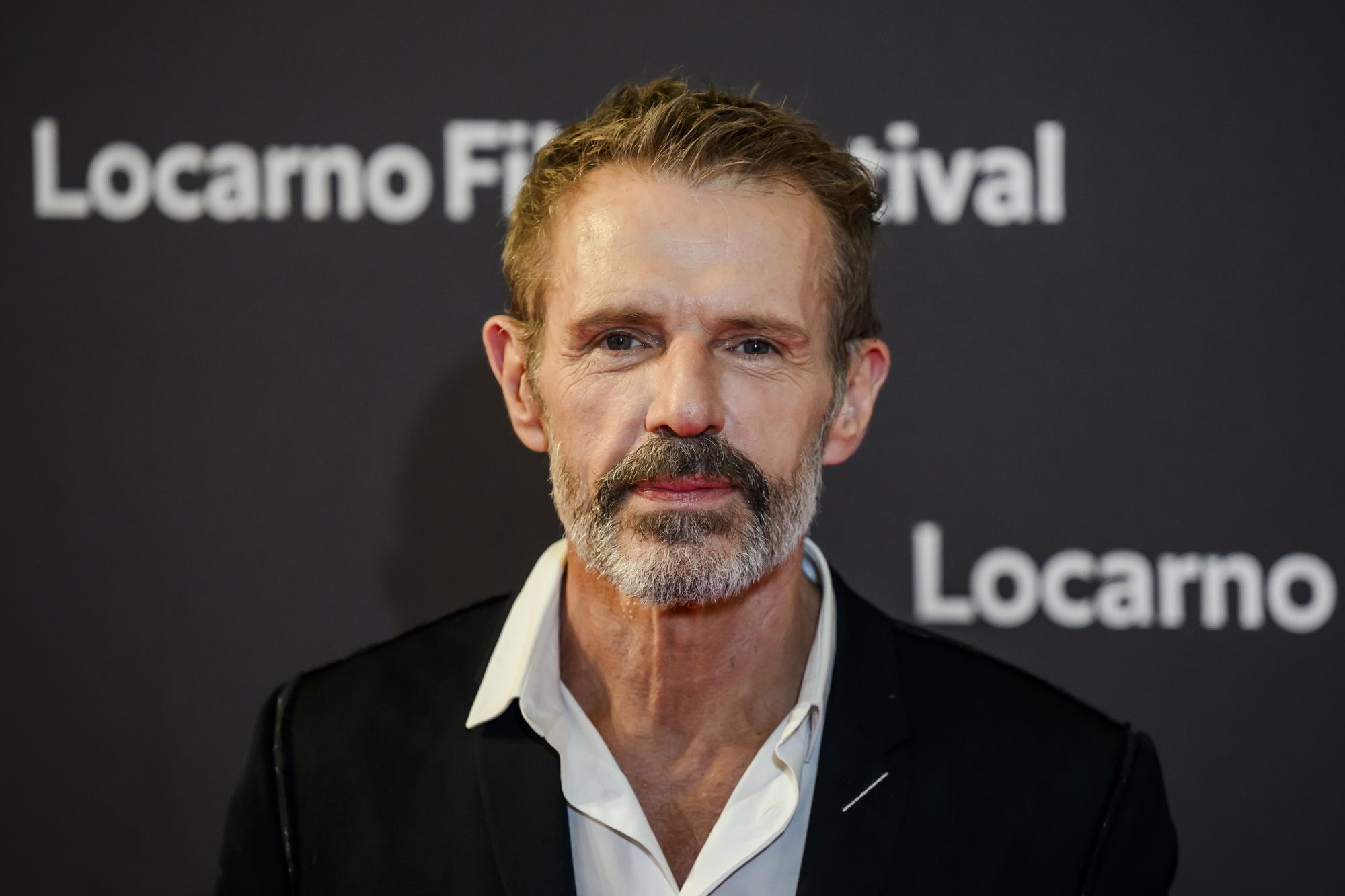 epa10782051 French actor Lambert Wilson, jury president of Locarno film festival, reacts on the red carpet during the opening ceremony at the 76th Locarno International Film Festival in Locarno, Switzerland, 02 August 2023. The 76th Locarno Film Festival takes place from 02 to 12 August. EPA/JEAN-CHRISTOPHE BOTT
