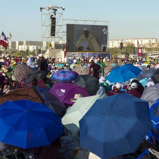 Pilgrims gather at Parque Tejo in Lisbon where Pope Francis is presiding over a mass celebrating the 37th World Youth Day, Sunday, Aug. 6, 2023. An estimated 1.5 million young people filled the parque on Saturday for Pope Francis' World Youth Day vigil, braving scorching heat to secure a spot for the evening prayer and to camp out overnight for his final farewell Mass on Sunday morning. (AP Photo/Ana Brigida)
