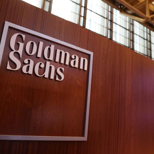 FILE PHOTO: The logo for Goldman Sachs is seen on the trading floor at the New York Stock Exchange (NYSE) in New York City, New York, U.S., November 17, 2021. REUTERS/Andrew Kelly/File Photo