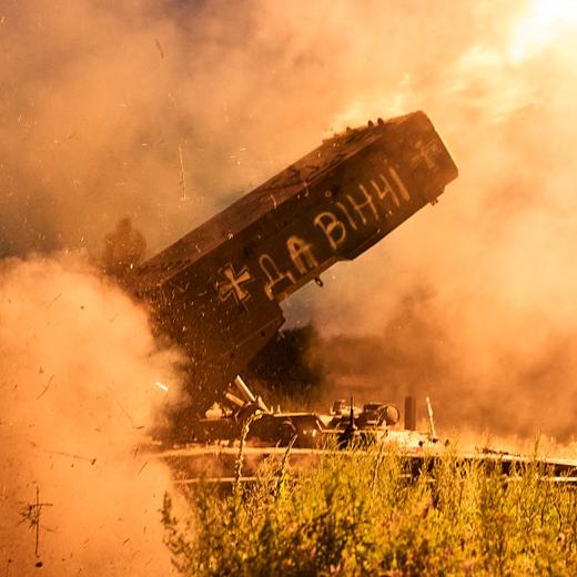 A Russian TOS-1A Solntsepyok heavy flamethrower rocket launcher, captured by the Ukrainian army battalion "Da Vinci", fires towards the Russian positions on the frontline near Kreminna, Luhansk region, Ukraine, Friday, July 7, 2023. Writing on its body reads "Da Vinci", a code name of the battalion commander Dmytro Kotsiubaylo, who was killed in battle. (AP Photo/Libkos)