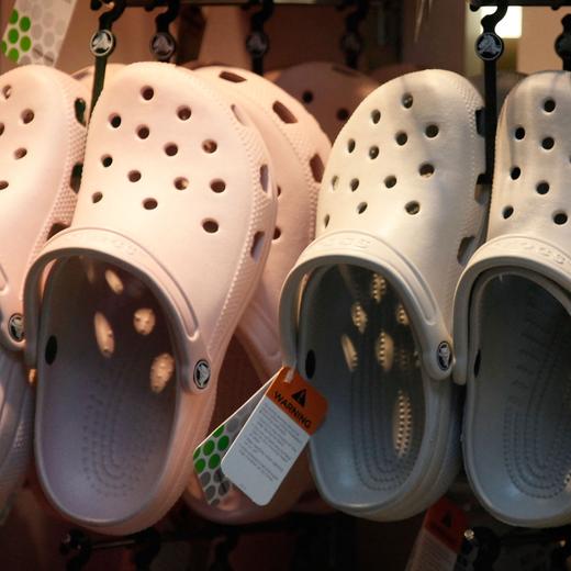CHICAGO - JULY 23: Crocs footwear is displayed in one of the company's retail stores July 23, 2009 in Chicago, Illinois. The struggling shoe manufacturer went public in 2006 and has since seen its stock price plummet from more than $70 a share to about $3 a share. Scott Olson/Getty Images/AFP (Photo by SCOTT OLSON / GETTY IMAGES NORTH AMERICA / Getty Images via AFP)