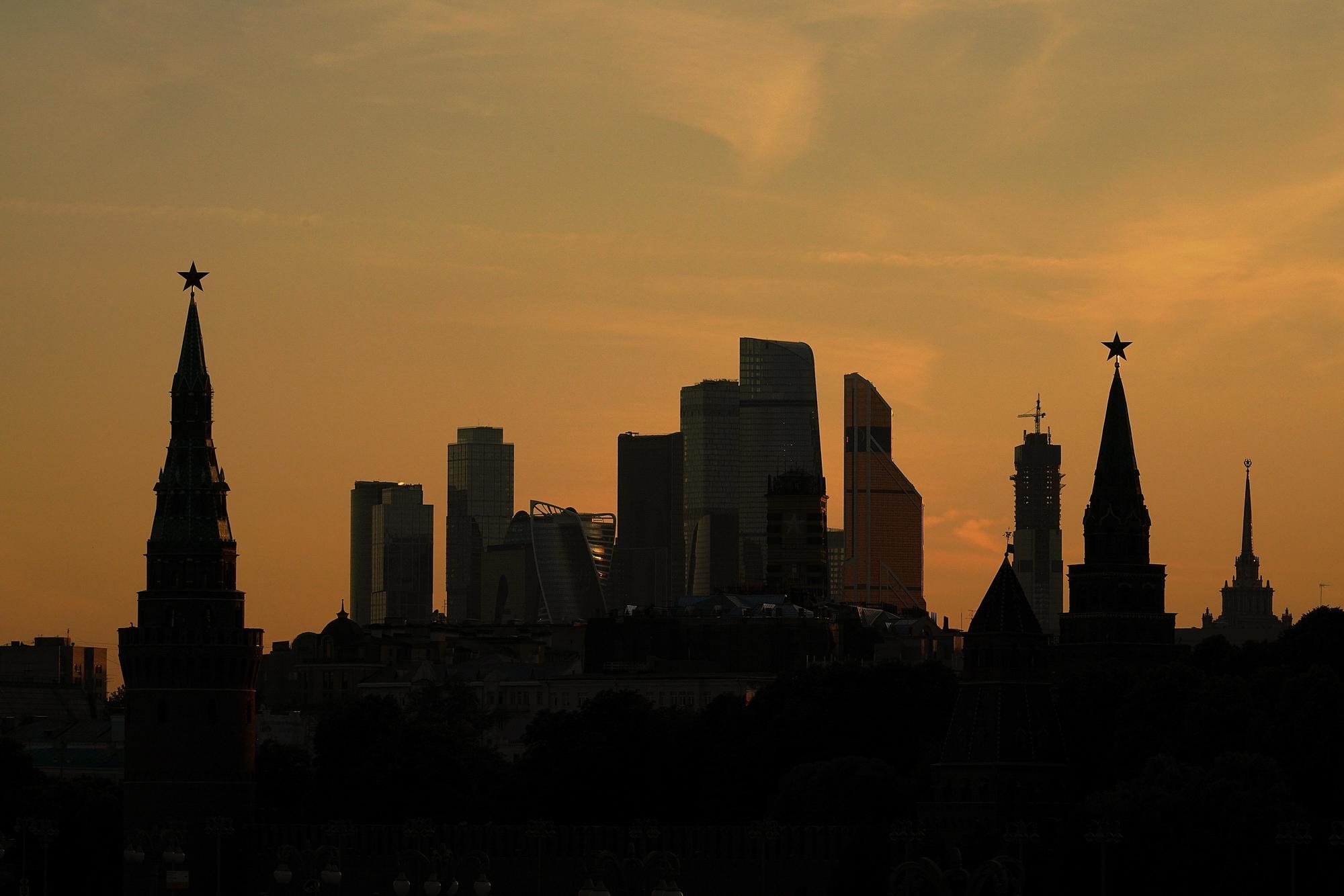 MOSCOW, RUSSIA - JUNE 15: The Kremlin is silhouetted at sunset against the modern skyscrapers of Moscow during The World Cup tournament on June 15, 2018 in Moscow, Russia. Russia won the opening game of the tournament against Saudi Arabia 5-0. (Photo by Christopher Furlong/Getty Images)