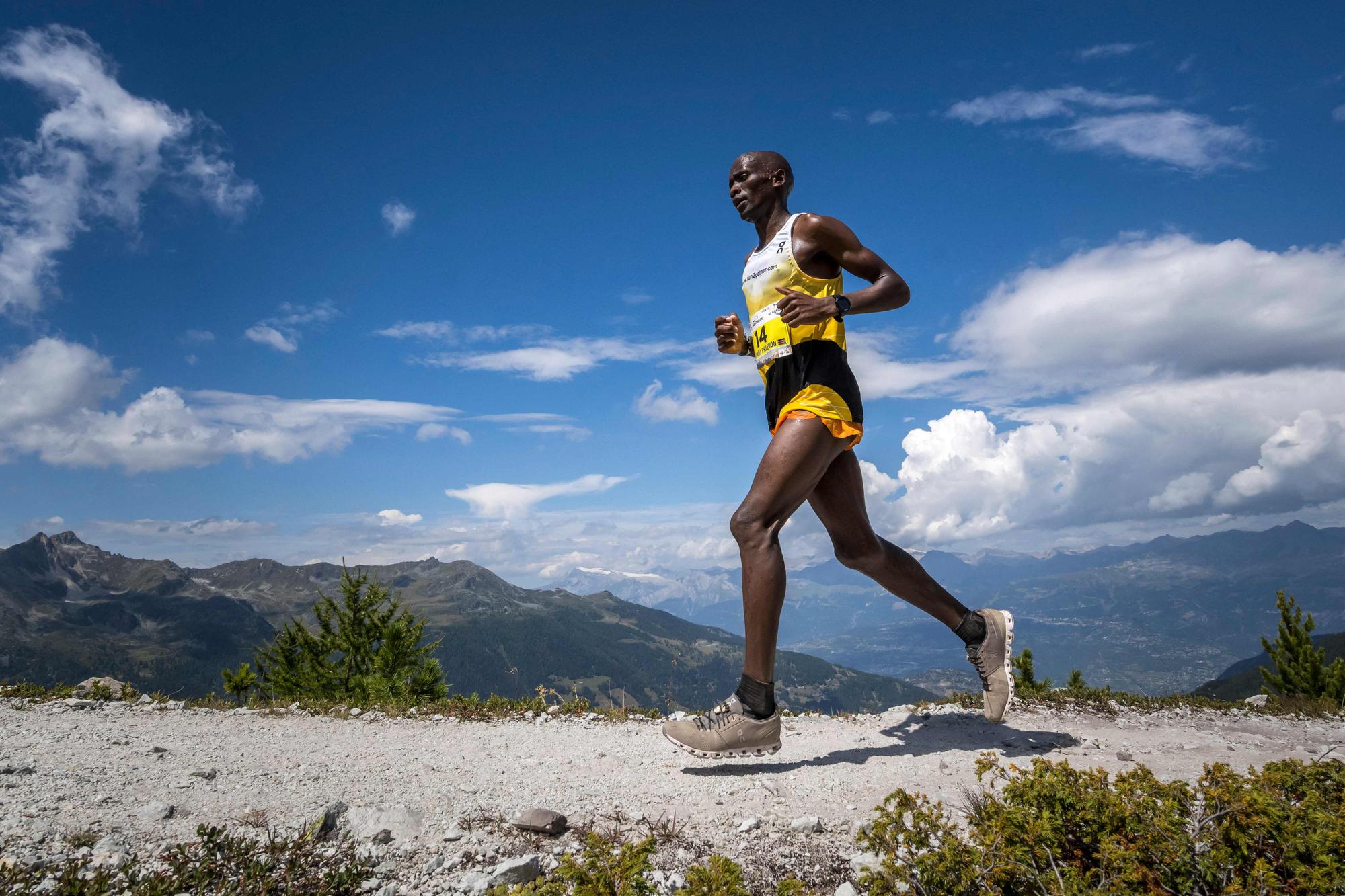 Kenya's Philemon Ombogo Kiriago competes near Saint-Luc on August 12, 2023 to win the 50th edition of Sierre-Zinal, a daunting 31-km mountain race involving a 2200 meter elevation gain and a 1100 meter vertical drop in the heart of the Swiss Alps, part of the Golden Trail Series. (Photo by Fabrice COFFRINI / AFP)