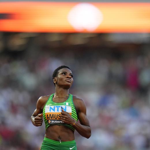 Tobi Amusan, of Nigeria crosses the line to finish a Women's 100-meters hurdles heat during the World Athletics Championships in Budapest, Hungary, Tuesday, Aug. 22, 2023. (AP Photo/Petr David Josek)