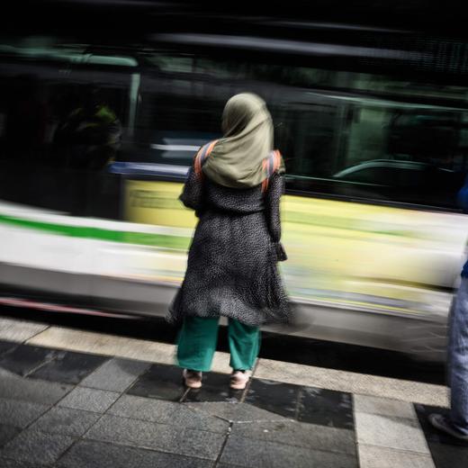 A young woman wears an Abaya (C) as she stands on a street in Nantes, western France on August 31, 2023. The French government's decision to ban schoolgirls wearing abayas -- long, flowing dresses of Middle Eastern origin -- has opened a fresh debate about the country's secular laws and the treatment of Muslim minorities. (Photo by LOIC VENANCE / AFP)