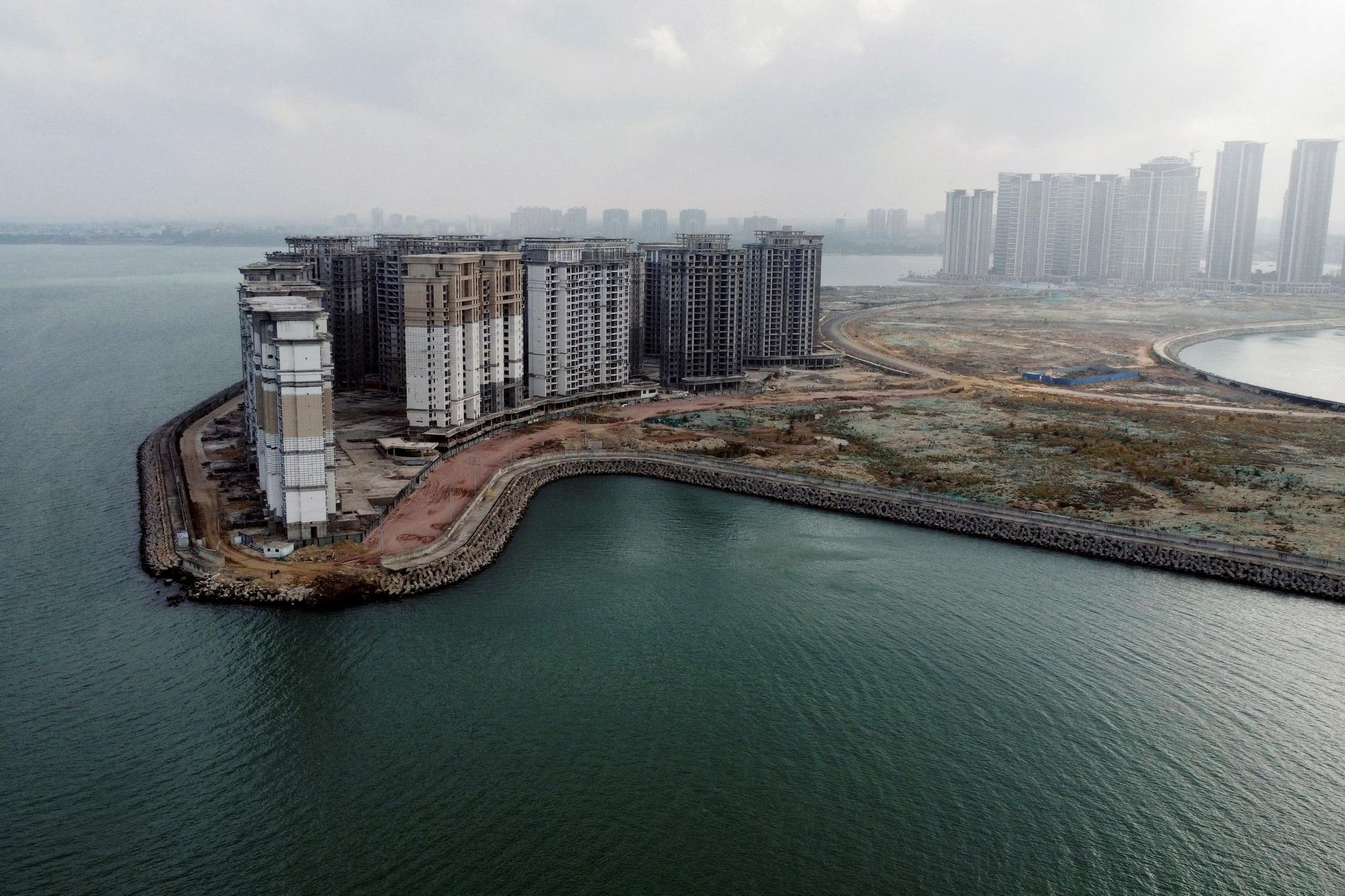 An aerial view shows the 39 buildings developed by China Evergrande Group that authorities have issued demolition order, on the man-made Ocean Flower Island in Danzhou, Hainan province, China January 7, 2022. REUTERS/Aly Song/File Photo To Match Special Report CHINA-PROPERTY/EVERGRANDE-HUI