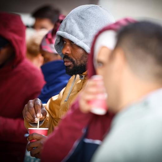 epa10146541 Asylum seekers wait outside the new temporary center for applicants for international protection in Brussels, Belgium, 30 August 2022. Since the beginning of August, more than 2000 people have registered as applicants for international protection. The relocation of the registration center took place because the protection of migrants, NGOs and Fedasil could no longer be ensured in the old registration center. EPA/STEPHANIE LECOCQ