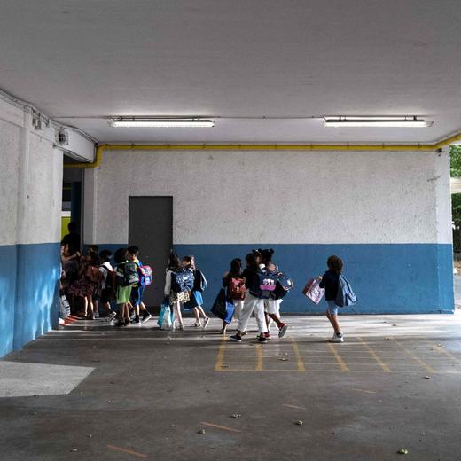 Pupils head to class on the first day of the new academic year at Moliere school in Toulouse, southwestern France, on September 4, 2023. (Photo by Charly TRIBALLEAU / AFP)