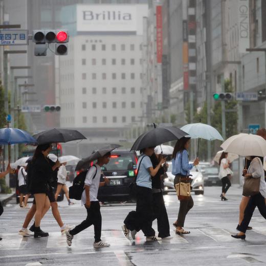 Passersby holding umbrellas walk on a street in the rain as tropical storm Yun-yeung approaches Japan, in Tokyo, Japan September 8, 2023. REUTERS/Issei Kato