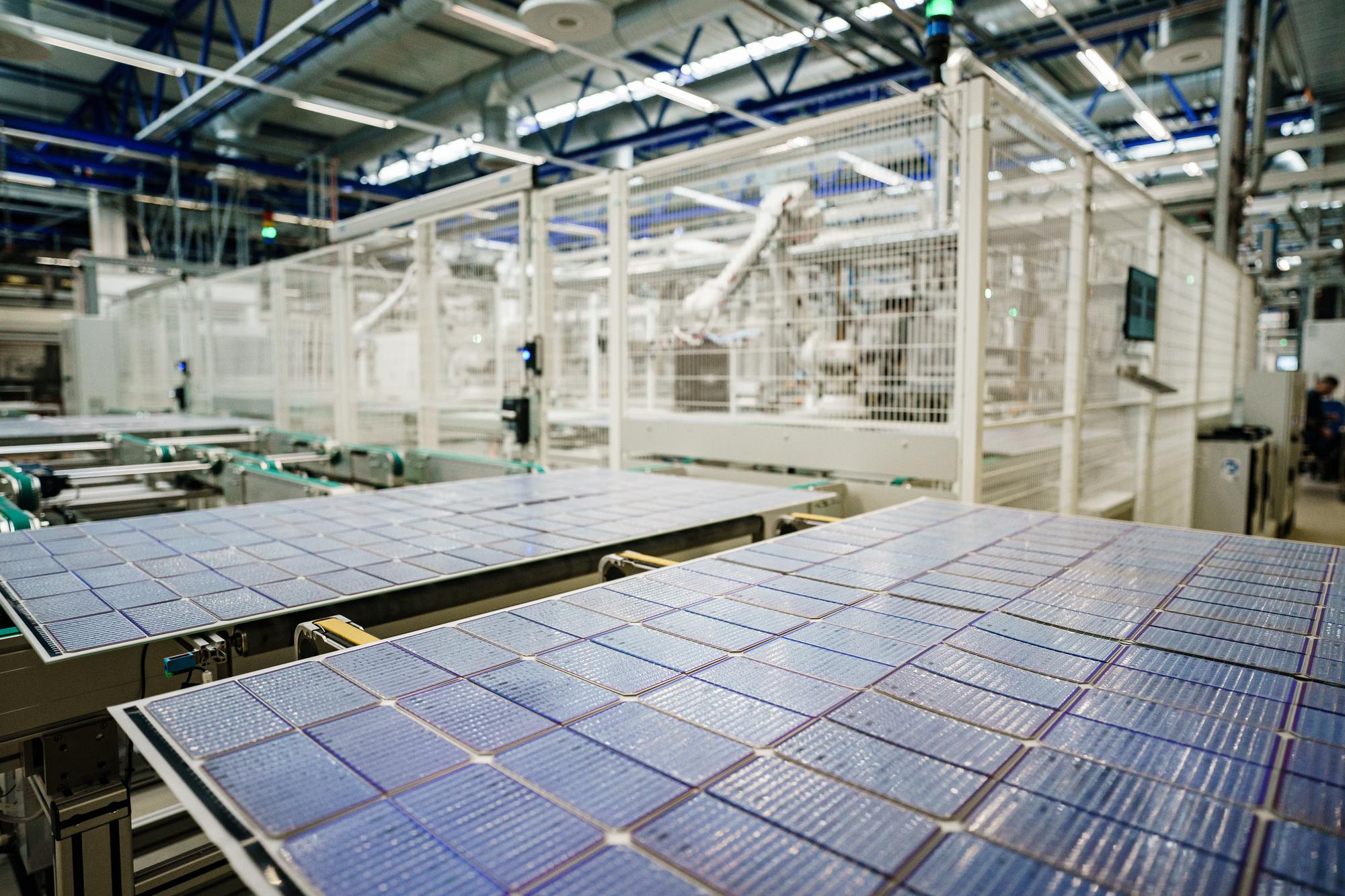epa10353828 Solar modules move on a production line at the Solar module manufacturer Meyer Burger (Industries) GmbH in Freiberg, Germany, 07 December 2022. The nearly 70 year old company Meyer Burger (Industries) GmbH produces solar panels with a 40 year expertise in photovoltaics in the Saxon city of Freiberg near Dresden. EPA/CLEMENS BILAN