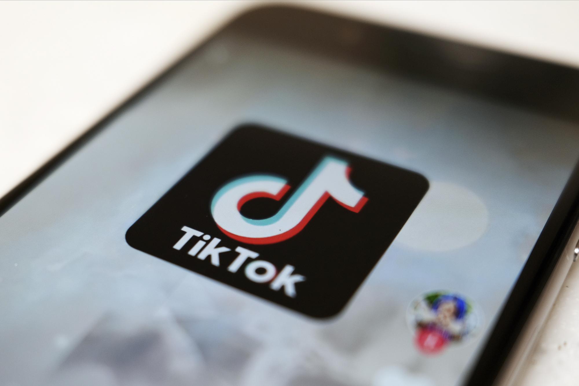 FILE - This Sept. 28, 2020, file photo, shows a TikTok logo on a smartphone screen in Tokyo. After months of testing, TikTok is fully launching its e-commerce product in the U.S., in an effort to translate the app?s cultural relevance among young consumers to sales. The company said Tuesday, Sept. 12, 2023 its shopping wing, called TikTok Shop, will include several features such as a ?Shop Tab,? a marketplace its been testing on the app since August. (AP Photo/Kiichiro Sato, File)