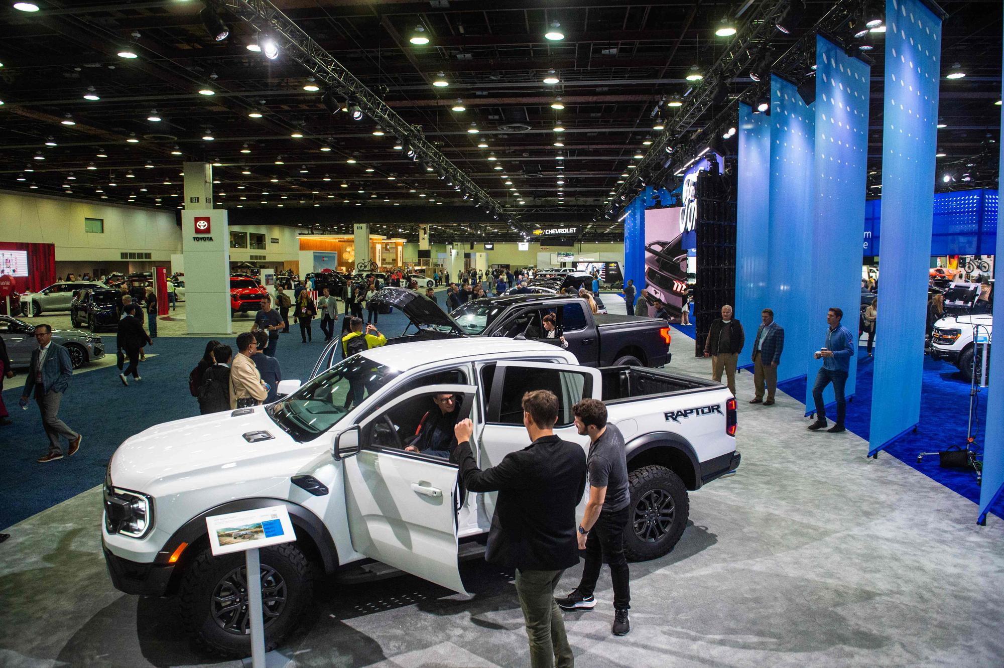 People attend the 2023 North American International Auto Show at the Huntington Place convention center in Detroit, Michigan, on September 13, 2023. (Photo by Matthew Hatcher / AFP)