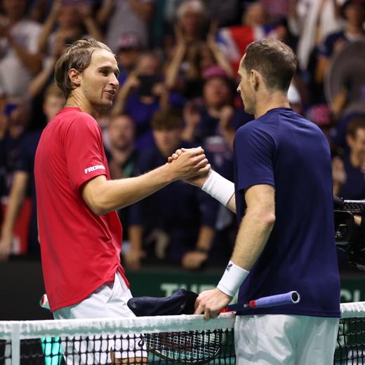 epa10862491 Leandro Riedi of Switzerland (L) shakes hands with Andy Murray of Great Britain (R) after the Davis Cup Finals Group B match between Great Britain and Switzerland at the AO Arena in Manchester, Britain, 15 September 2023. EPA/ADAM VAUGHAN