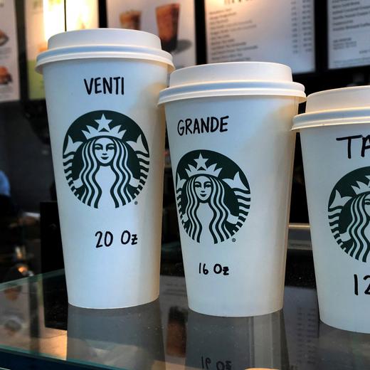 FILE PHOTO: Starbucks cups are pictured on a counter in the Manhattan borough of New York City, New York, U.S., February 16, 2022. REUTERS/Carlo Allegri/File Photo