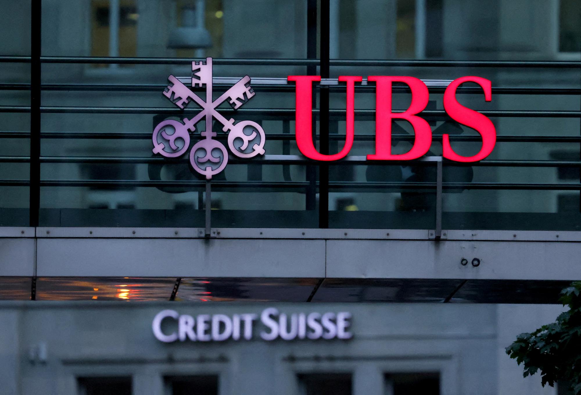 FILE PHOTO: Logos of Swiss banks Credit Suisse and UBS are seen before a news conference in Zurich Switzerland, August 30, 2023. REUTERS/Denis Balibouse/File Photo