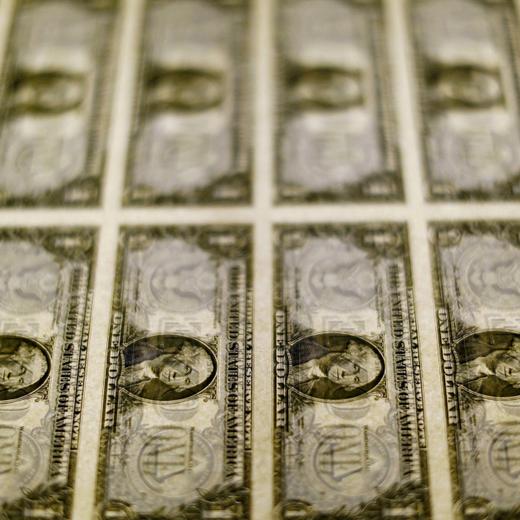 FILE PHOTO: U.S. dollar bills are seen on a light table at the Bureau of Engraving and Printing in Washington, November 14, 2014. REUTERS/Gary Cameron/File Photo