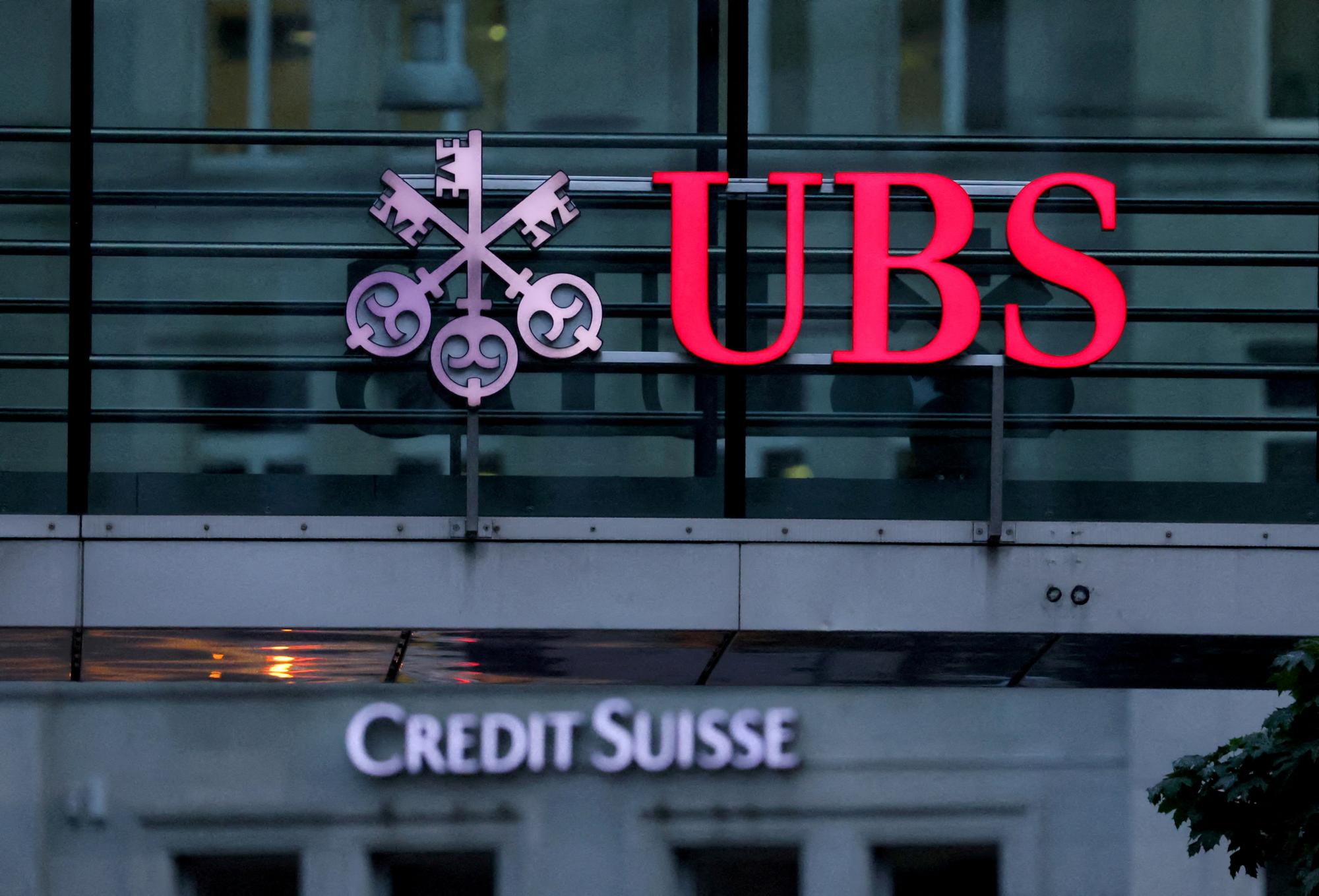 FILE PHOTO: Logos of Swiss banks Credit Suisse and UBS are seen before a news conference in Zurich Switzerland, August 30, 2023. REUTERS/Denis Balibouse/File Photo