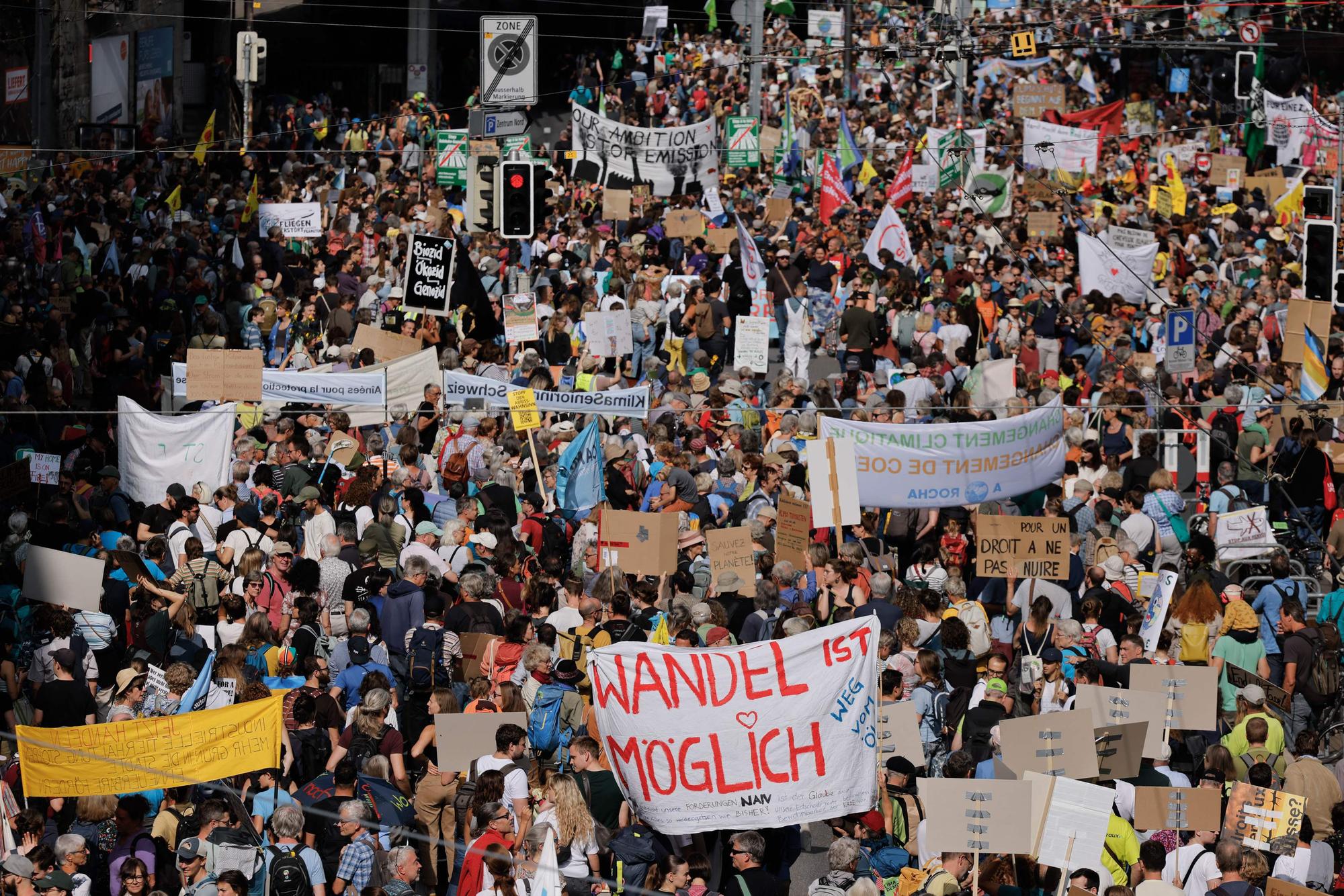 Demonstrators take part to a national protest for climate justice in Swiss capital Bern, on September 30, 2023. (Photo by Valentin Flauraud / AFP)