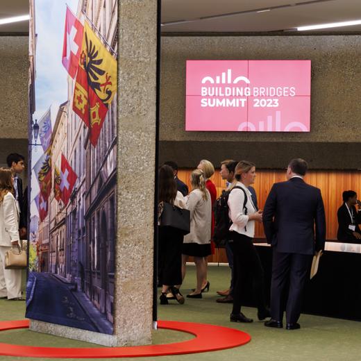 People speak together during the Building Bridges Summit on sustainable finance, at the CICG in Geneva, Switzerland, Monday, October 2, 2023. (KEYSTONE/Salvatore Di Nolfi)