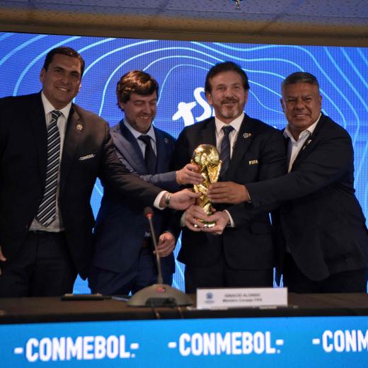 (L-R) Paraguayan Football Association President Robert Harrison, Uruguayan Football Association President Ignacio Alonso, Conmebol President Alejandro Dominguez and Argentine Football Association President Claudio Tapia hold a replica of the World Cup trophy after announcing in a press conference in Luque, Paraguay, on October 4, 2023, that the "inaugural matches" of the 2030 World Cup will be played in Uruguay, Argentina and Paraguay, as it emerged that the host country for the tournament will be shared between Spain, Portugal and Morocco. Morocco, Portugal and Spain will be joint hosts for the 2030 World Cup but games will also be played in Uruguay, Argentina and Paraguay, FIFA announced on October 4. FIFA said in a statement that the matches in South America were part of the celebration of the centenary of the first World Cup in Uruguay. The statement said a "centenary ceremony" will be held "at the stadium where it all began", in Montevideo's Estadio Centenario in 1930. (Photo by Norberto DUARTE / AFP)