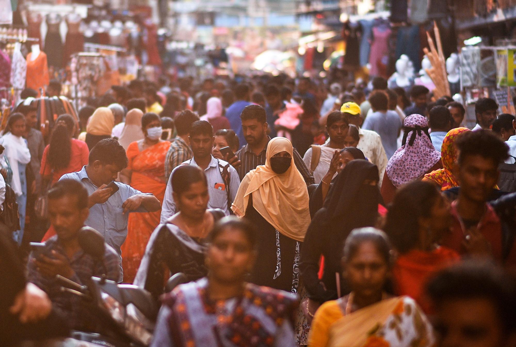 epa10573512 People arrive to shop at the crowded Ranganathan street, in Chennai, India, 13 April 2023 (issued 15 April 2023). The worldâ€™s population has reached 8 billion on 15 November 2022, with China and India, both with over one billion people, being the two most populous countries. The United Nations Population Fund has projected India will surpass China as the world's most populous country in 2023, with about 1,429 people, while Chinaâ€™s population has been decreasing and UN projections estimate it will be around 1,426 billion people by the end of 2023. EPA/IDREES MOHAMMED