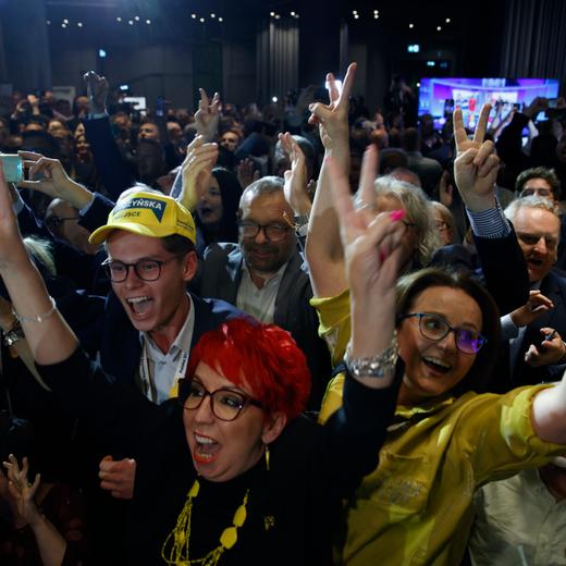 Supporters of the Third Way, a coalition of the centrist Poland 2050 party and the agrarian Polish People's Party celebrate at the electoral headquarters in Warsaw, Poland, Sunday, Oct. 15, 2023. Poland's election result is on a knife edge as an exit poll says that the governing Law and Justice party won the most votes. Three opposition parties, Civic Coalition, Third Way and the New Left, ran on separate tickets but with the same promises of seeking to oust Law and Justice and restore good ties with the European Union. (AP Photo/Michal Dyjuk)