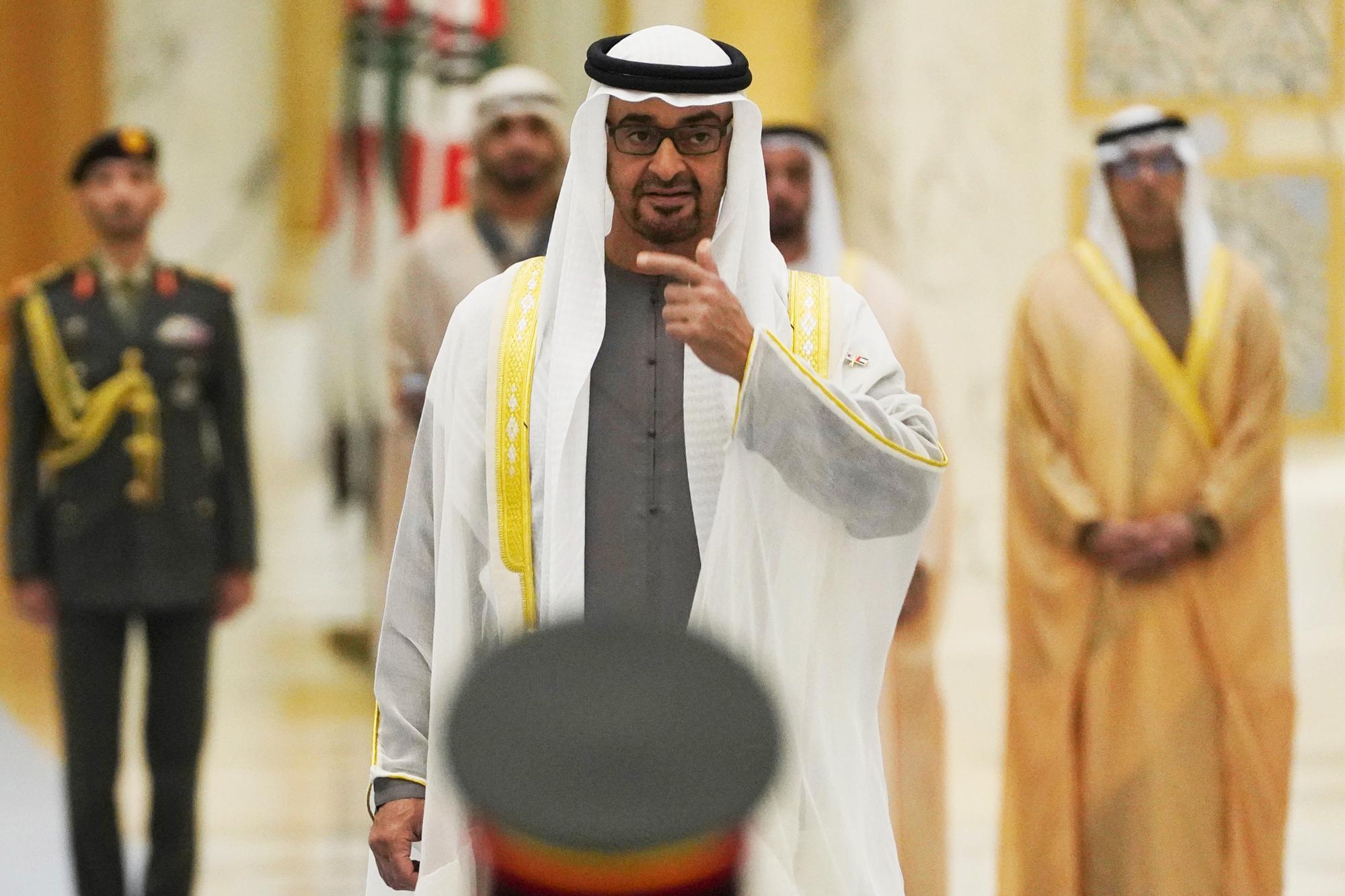 Emirati leader Sheikh Mohammed bin Zayed Al Nahyan gestures toward an honor guard at Qasar Al Watan in Abu Dhabi, United Arab Emirates, Sunday, Jan. 15, 2023. South Korean President Yoon Suk Yeol received an honor guard welcome Sunday on a trip to the United Arab Emirates, where Seoul hopes to expand its military sales while finishing its construction of the Arabian Peninsula's first nuclear power plant. (AP Photo/Jon Gambrell)