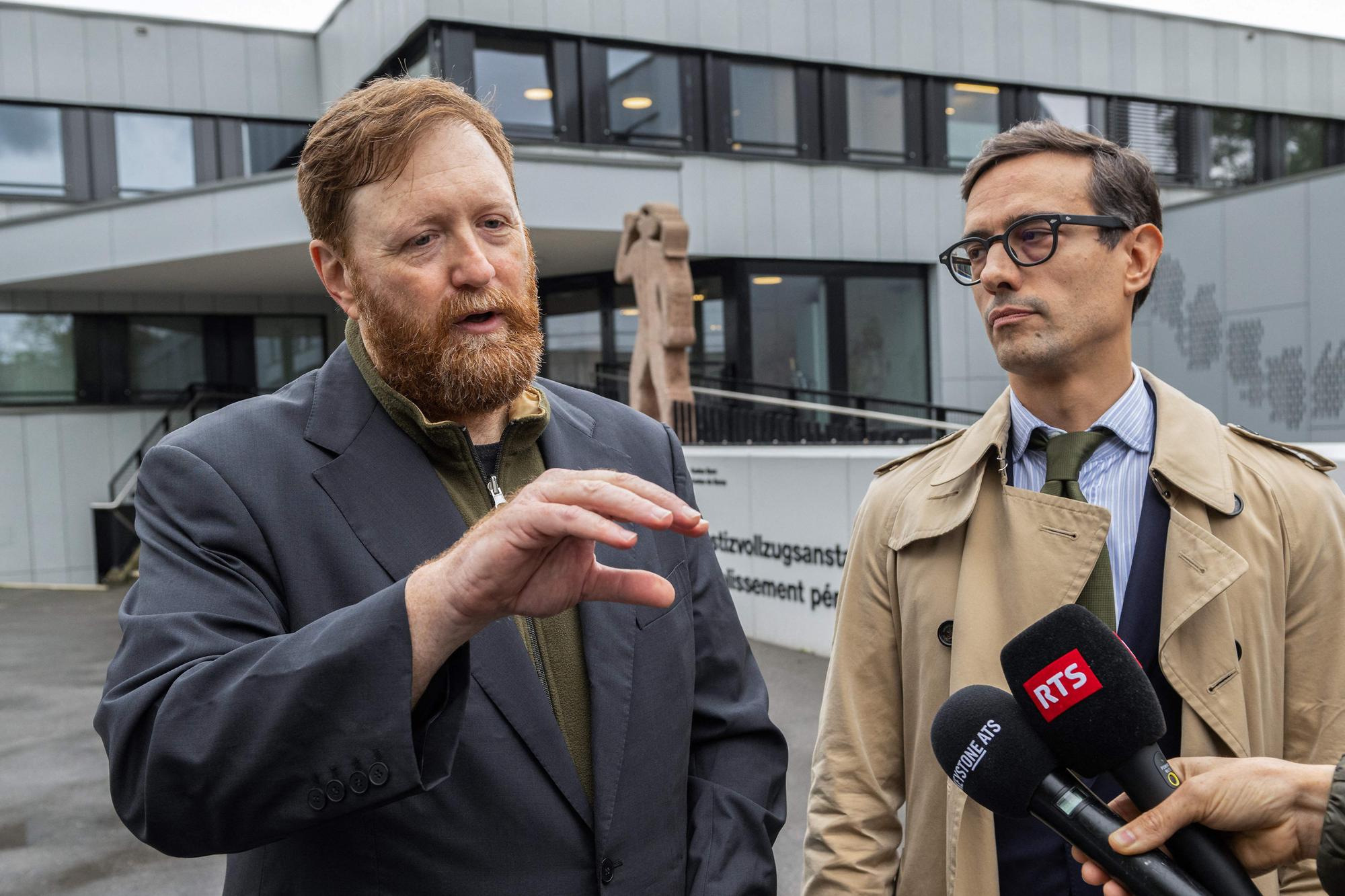 Guatemala's former police chief Erwin Sperisen (L) speaks to journalists next to his lawyer Giorgio Campa after leaving the Witzwil prison near Gampelen on October 20, 2023. The Swiss Federal Court has overturned the 15-year prison sentence of Erwin Sperisen, Guatemala's former police chief, for complicity in murder, according to a ruling published on October 20, 2023. The judgment asks the Criminal Chamber of Appeal and Revision" of the Canton of Geneva to resume the investigation. (Photo by Jean-Guy PYTHON / AFP)