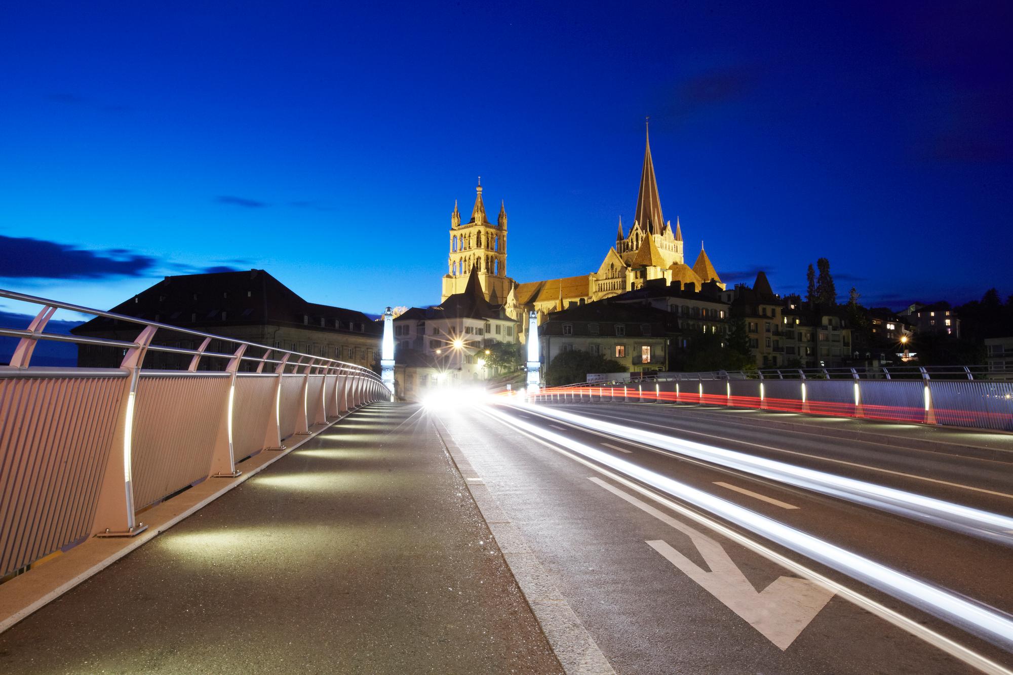 Elevated view of Cathedral of Lausanne and bridge of Bessieres at night