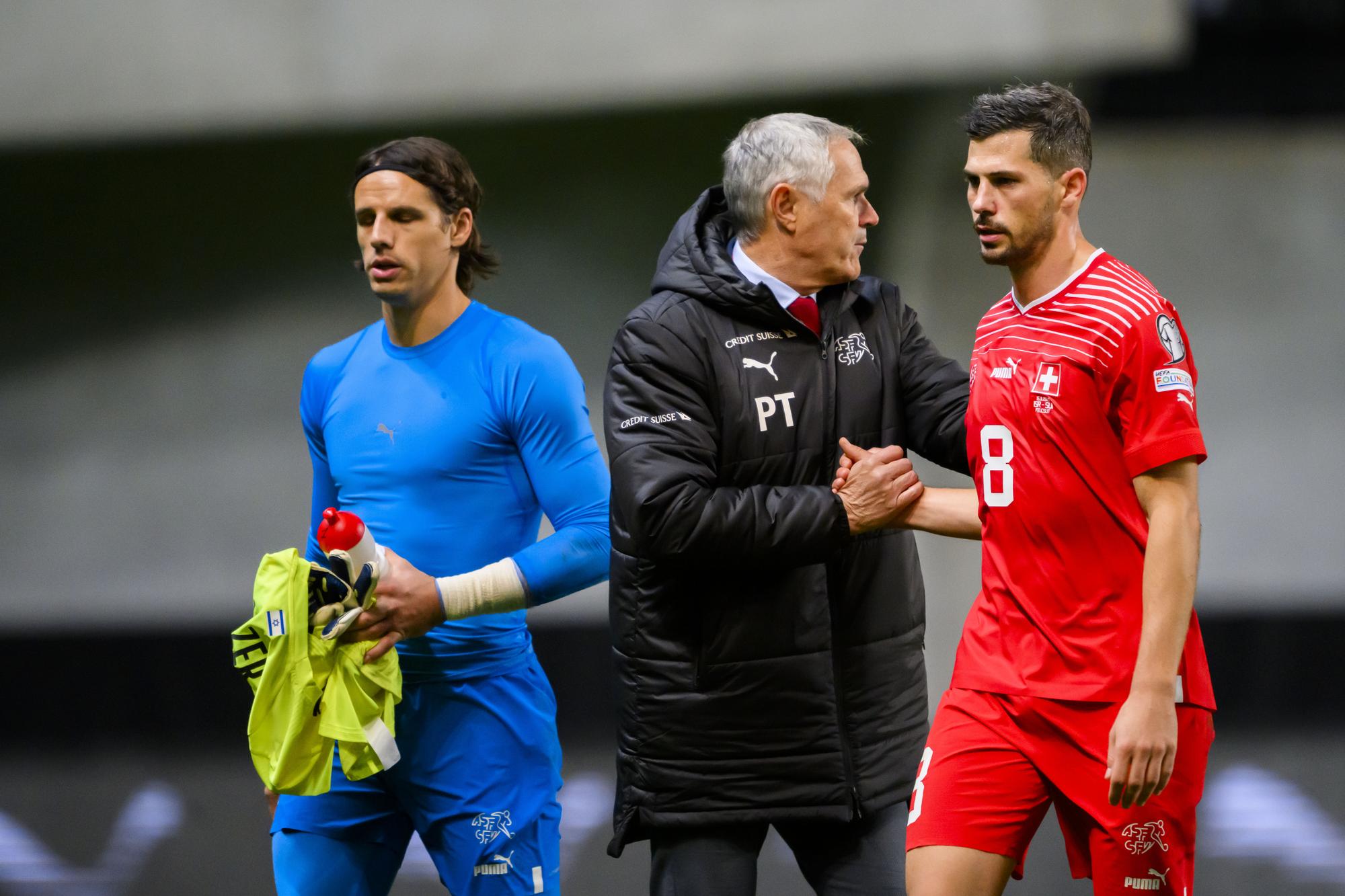 Switzerland's goalkeeper Yann Sommer, left, Switzerland's national soccer teams director Pierluigi Tami, center, and Switzerland's midfielder Remo Freuler, right, are disappointed during the UEFA Euro 2024 qualifying group I soccer match between Israel and Switzerland at Pancho Arena in Felcsut, southwest of Budapest, Hungary, Wednesday, November 15, 2023. (KEYSTONE/Laurent Gillieron)