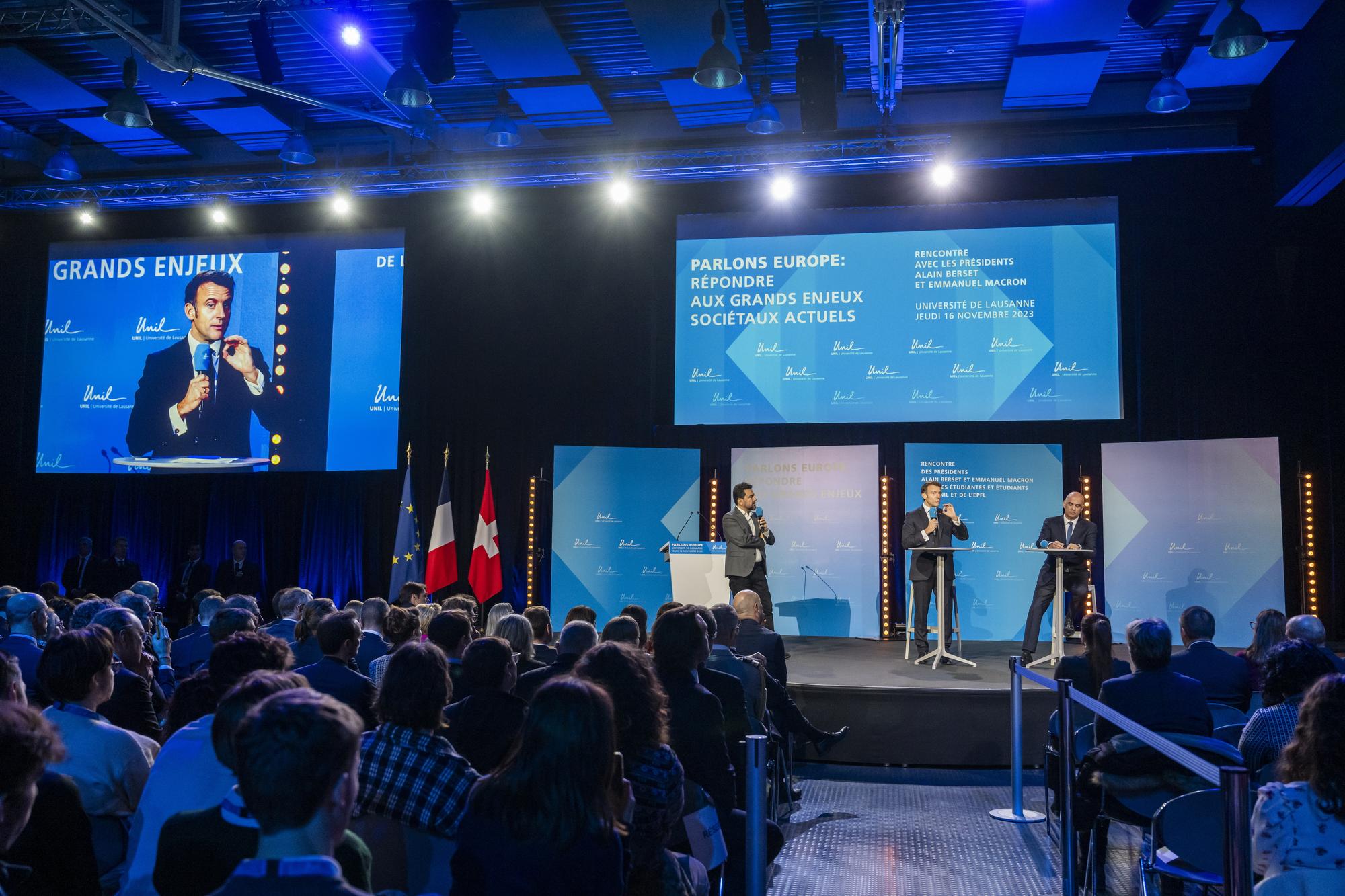 epa10978321 French President Emmanuel Macron (L) and Swiss President Alain Berset (R) attend a public conference on the theme 'Let's Talk Europe responding to major current societal issues', at the University of Lausanne, UNIL/EPFL, in Lausanne, Switzerland, 16 November 2023. French President Macron and his wife Brigitte are visiting Switzerland for a two day state visit. EPA/MARTIAL TREZZINI